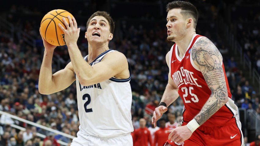 Collin Gillespie #2 of the Villanova Wildcats attempts a shot as Kyle Young #25 of the Ohio State Buckeyes defends in the second half of the game during the second round of the 2022 NCAA Men’s Basketball Tournament at PPG PAINTS Arena on March 20, 2022 in Pittsburgh, Pennsylvania. (Photo by Rob Carr/Getty Images)