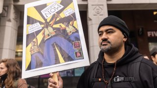 A demonstrator during the vote count to unionize Amazon workers outside the National Labor Relations Board offices in New York, U.S., on Friday, April 1, 2022.