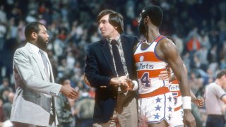 LANDOVER, MD – CIRCA 1984: Head coach Gene Shue of the Washington Bullets with his player Ricky Sobers #14 during an NBA basketball game circa 1984 at the Capital Centre in Landover, Maryland. Shue coached the Washington Bullets from 1980-86. (Photo by Focus on Sport/Getty Images)