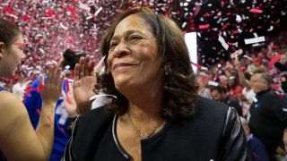 Head coach C. Vivian Stringer of the Rutgers Scarlet Knights celebrates her 1,000 career win