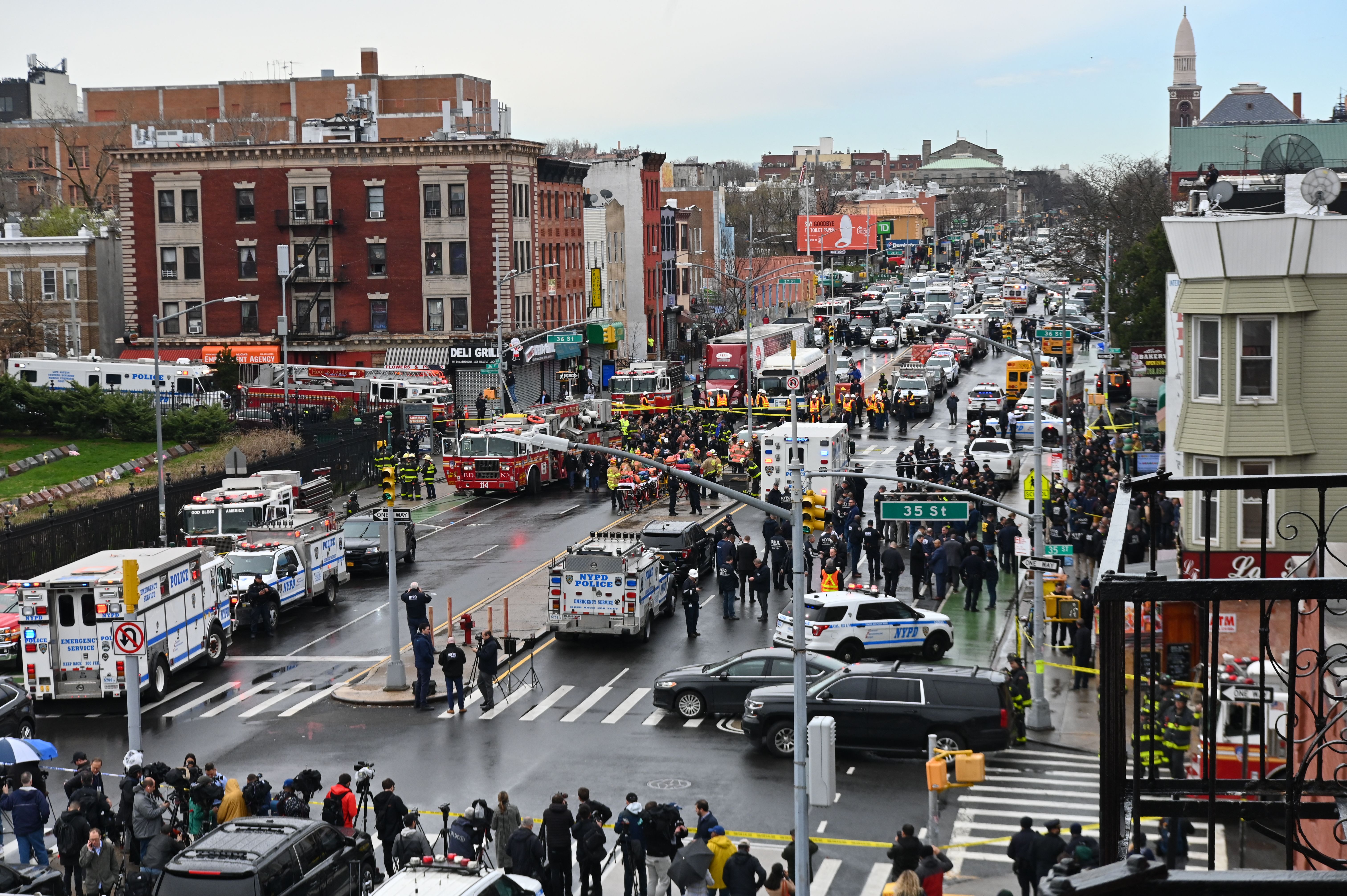 Emergency vehicles and the NYPD crowd the streets after at least 16 people were injured during a rush-hour shooting at a subway station Brooklyn, New York, on April 12, 2022.