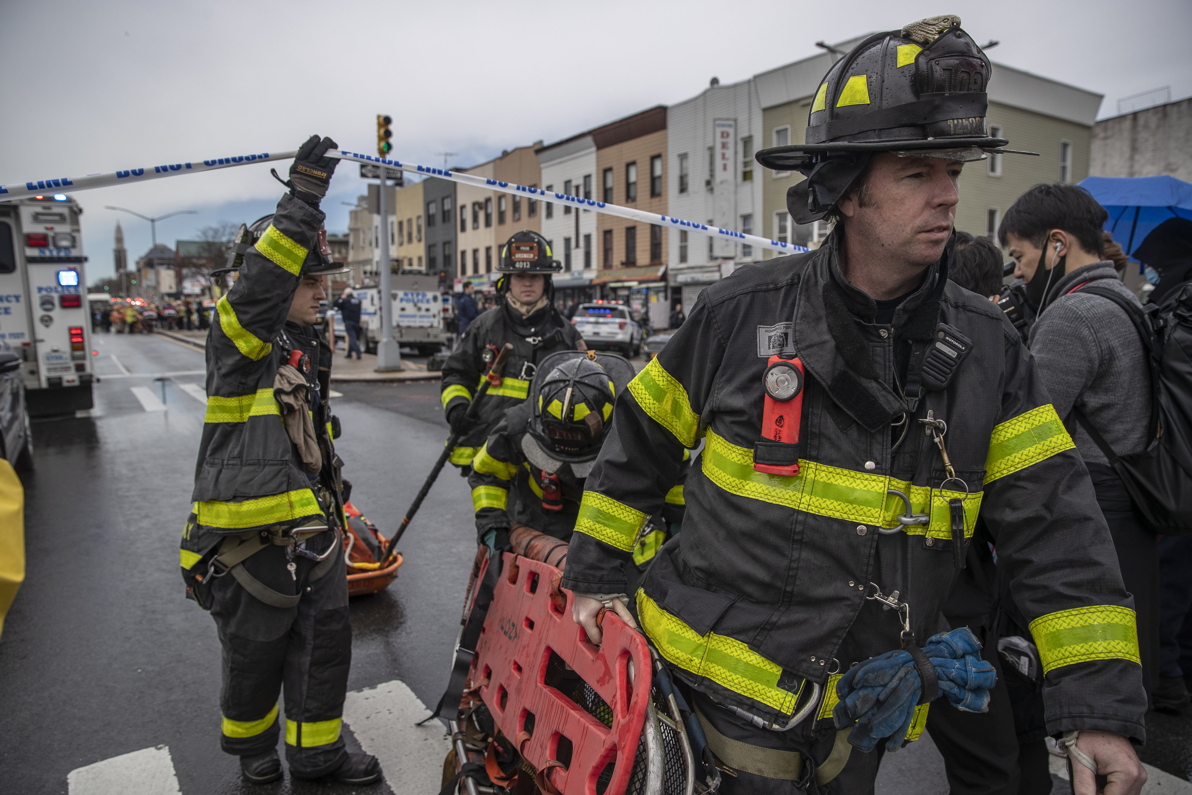 New York City Fire Department firefighters respond to the scene of a rush-hour shooting at a subway station in Brooklyn, New York, on April 12, 2022. 