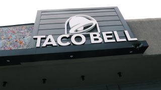 A Taco Bell restaurant stands along a Queens street on July 21, 2021 in New York City