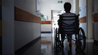 a woman in a wheelchair at a nursing home