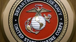 The US Department of the Navy, US Marine Corps, logo hangs on the wall on February 24, 2009, at the Pentagon in Washington, DC.