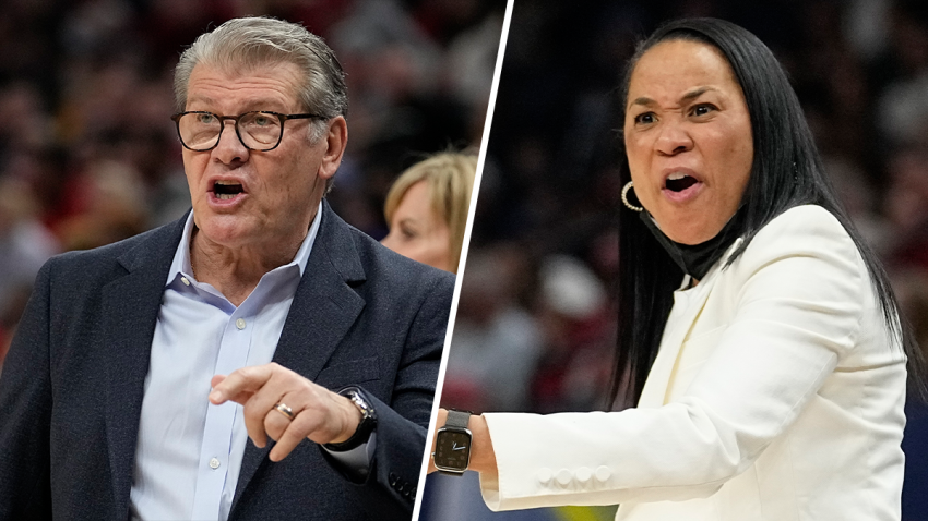 UConn head coach Geno Auriemma (right) and South Carolina head coach Dawn Staley (left) react during the first half of a college basketball game in the semifinal round of the Women’s Final Four NCAA tournament Friday, April 1, 2022, in Minneapolis.
