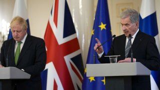 British Prime Minister Boris Johnson, here seen addressing a press conference with Finnish President Sauli Niinisto in Helsinki, Finland, on Wednesday, signed a security pact with Finland just ahead of the European nation’s decision on whether to apply for NATO membership.