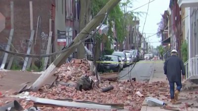 House Partially Collapses Sending Debris Onto Street, Knocking Over Utility Pole