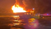 A barge burns on Delaware Bay on May 23, 2022