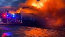 A barge burns on Delaware Bay on May 23, 2022