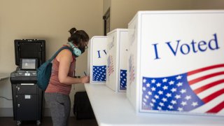 A voter casts a ballot at a polling location in Pittsburgh, Pennsylvania