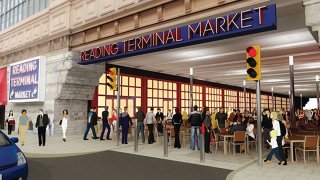 This rendering shows a sign reading "Reading Terminal Market" above an overpass under which people sit and walk.
