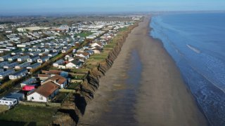 Houses on the east coast of England, photographed in 2020. On Tuesday, the chief executive of the U.K.’s Environment Agency said climate change meant some coastal communities would have to move.