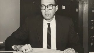 In this photo provided by the LGBT Center of Central PA History Project Collection at the Dickinson College Archives and Special Collections, Richard Schlegel is seen in his office at the Pennsylvania Department of Highways.