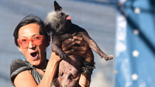 Janeda Banelly reacts to the announcement that her dog Mr. Happy Face won the World's Ugliest Dog Contest in Petaluma, California, on June 24, 2022.