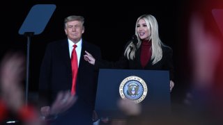 U.S. President Donald Trump looks on as his daughter, Ivanka