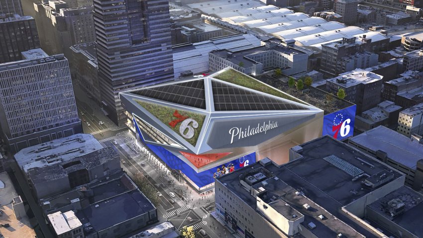 A rendering shows an aerial view of the 76ers' proposed arena. It would be surrounded by high-rises.