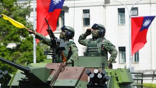 Taiwanese soldiers on a armoured vehicle during the National Day Celebration in Taipei, Taiwan, 10 October 2021. Before the Ukraine war began, only 26.6% of Taiwanese thought it was likely that China could suddenly start a war with Taiwan, according to a poll by the Taiwanese Public Opinion Foundation. After Russia invaded Ukraine, the percentage increased to 38.6%.