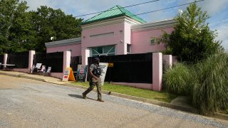 A security officer walks past the front of the Jackson Women's Health Organization clinic