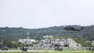 A Black Hawk helicopter ready to land during the live-fire drills at Hengchun Airport, in Pingtung, Taiwan, on Tuesday, Aug. 16, 2022. Wealthy, democratic and strategically located off the Chinese coast, Taiwan has long been the most volatile issue between the US and China. Photographer: I-Hwa Cheng/Bloomberg via Getty Images