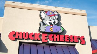 Logo and sign on facade of Chuck E Cheese's children's activity company in Dublin, California, July 23, 2018.