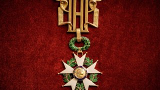 A photograph shows the large necklace of the Legion of Honor at the Elysee Palace in Paris