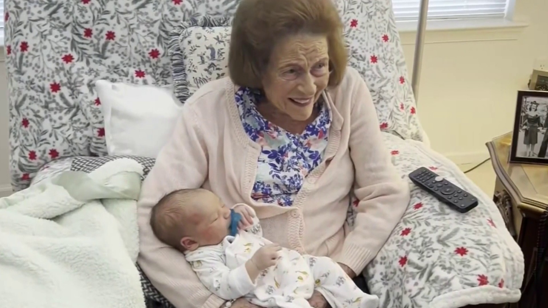 Marguerite Koller holds her 100th great-grandchild, Koller William