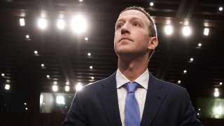 Facebook founder and CEO Mark Zuckerberg arrives to testify following a break during a Senate Commerce, Science and Transportation Committee and Senate Judiciary Committee joint hearing about Facebook on Capitol Hill in Washington, DC.