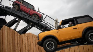 A Ford Bronco vehicle on a demonstrative course during the Motor Bella Auto Show in Pontiac, Michigan, U.S. on Tuesday, Sept. 21, 2021.
