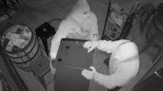 Masked men pry ATM from floor