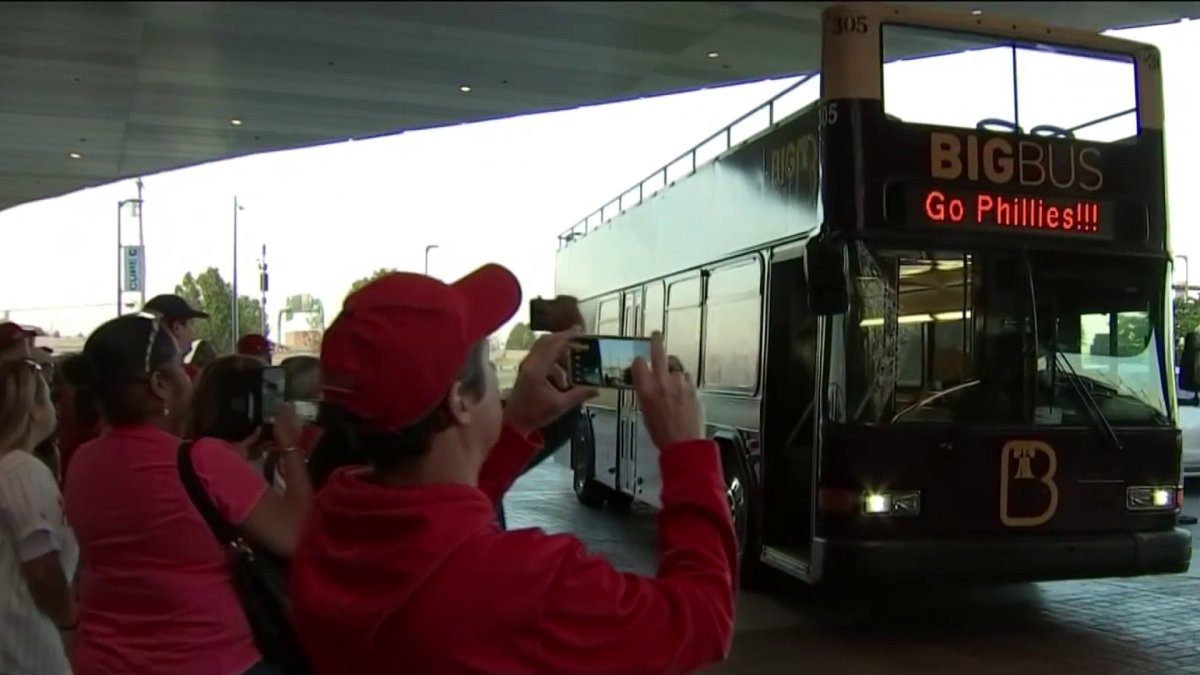 Phillies fans celebrate during Rally for Red October bus tour