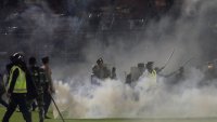 125 Die as Tear Gas Triggers Crush at Indonesia Soccer Match