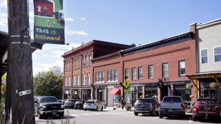 A pick-up truck rolls through downtown, Wednesday Oct. 5, 2022, in Richmond, Vt.