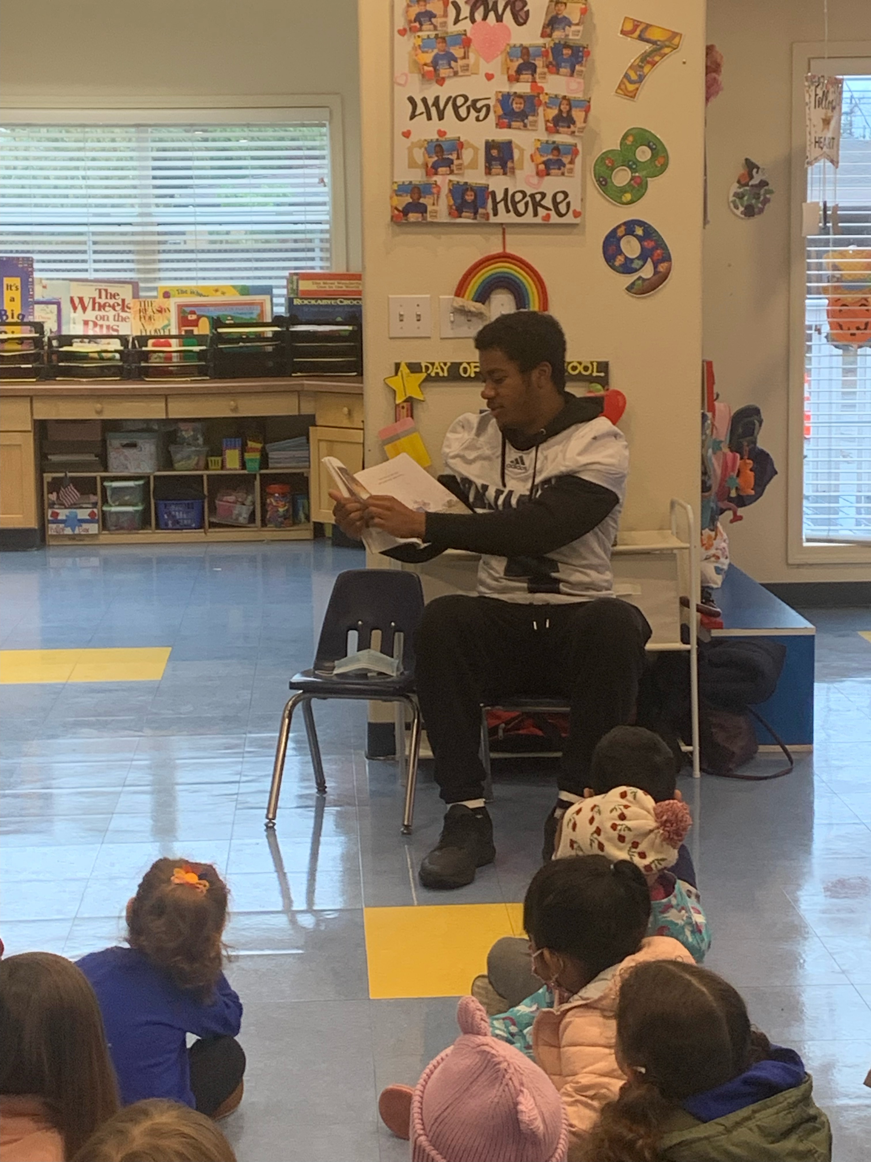 A photo of Camdan McWright reading to 4th Grade students at St. Genevieve Elementary School during the 2021-2022 school year. Photo Courtesy St. Genevieve Parish Schools.