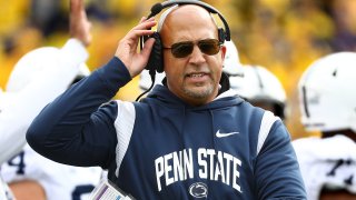Penn State coach James Franklin holding headset