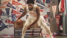 Joel Embiid dribbles basketball in 2022-23 Sixers City Edition jersey
