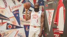 James Harden spins basketball in Sixers uniform