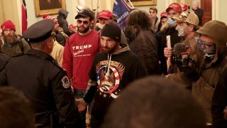 FILE - Protesters, including Doug Jensen, center, are seen amid a confrontation with police inside the U.S. Capitol Building on Jan. 6, 2021, in Washington, D.C.