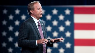 FILE - Texas Attorney General Ken Paxton speaks to the crowd at the Hilton Anatole Hotel in Dallas, Texas, on July 11, 2021.