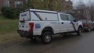 Philadelphia police crime scene truck parked on rainy street