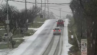 Vehicles on snowy Berks County road