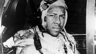 FILE – This circa 1950 photo provided by the U.S. Navy shows Jesse Brown in the cockpit of an F4U-4 Corsair fighter at an unidentified location. .