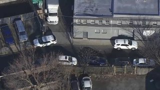 Philadelphia police cars outside business