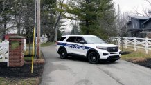 Police secure the entrance to the neighborhood of former Vice President Mike Pence's Indiana home, Friday, Feb. 10, 2023 in Carmel, Ind. The FBI is searching former Vice President Mike Pence’s Indiana home as part of a classified records probe. That's according to two people familiar with the search who were not authorized to discuss it and spoke on condition of anonymity. 