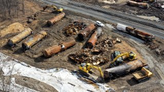 FILE - A view of the scene Friday, Feb. 24, 2023, as the cleanup continues at the site of of a Norfolk Southern freight train derailment that happened on Feb. 3 in East Palestine, Ohio.