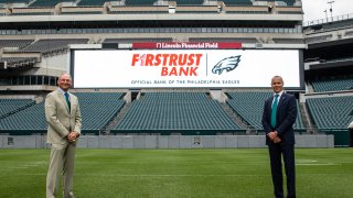 Richard Green, Chairman and CEO of Firstrust Bank (left) with Don Smolenski, Philadelphia Eagles President (right) at Lincoln Financial Field.