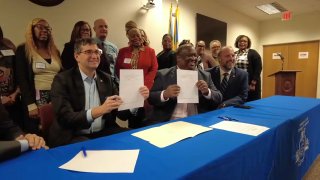 Officials in Delaware celebrate a new agreement to streamline the housing voucher program.