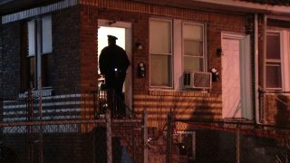 Officers investigate a home on Roosevelt Boulevard after an early morning shooting.