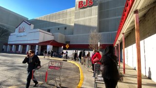 A line of shoppers wait to enter BJ’s Wholesale Club market at the Palisades Center shopping mall during the coronavirus outbreak in West Nyack, New York, March 14, 2020.