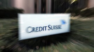 Signage for Credit Suisse Group AG outside a building, which houses the company’s branch, in Tokyo, Japan, on Monday, March 20, 2023. UBS Group AG agreed to buy Credit Suisse Group in a historic, government-brokered deal aimed at containing a crisis of confidence that had started to spread across global financial markets.